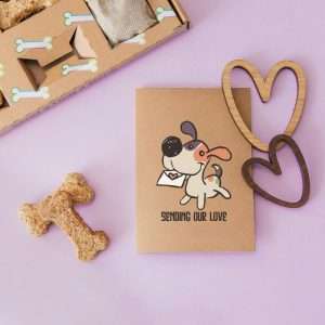 Greeting card with the phrase ‘Sending our love’ and a dog illustration.